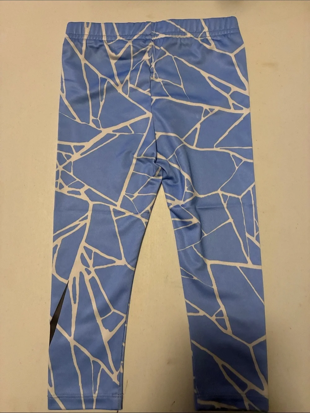 Nike Kids Light Blue & White Graphic Leggings with Black Swoosh